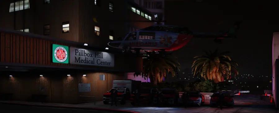 Pillbox Hill Medical Center at night, with ambulances and an EMS helicopter